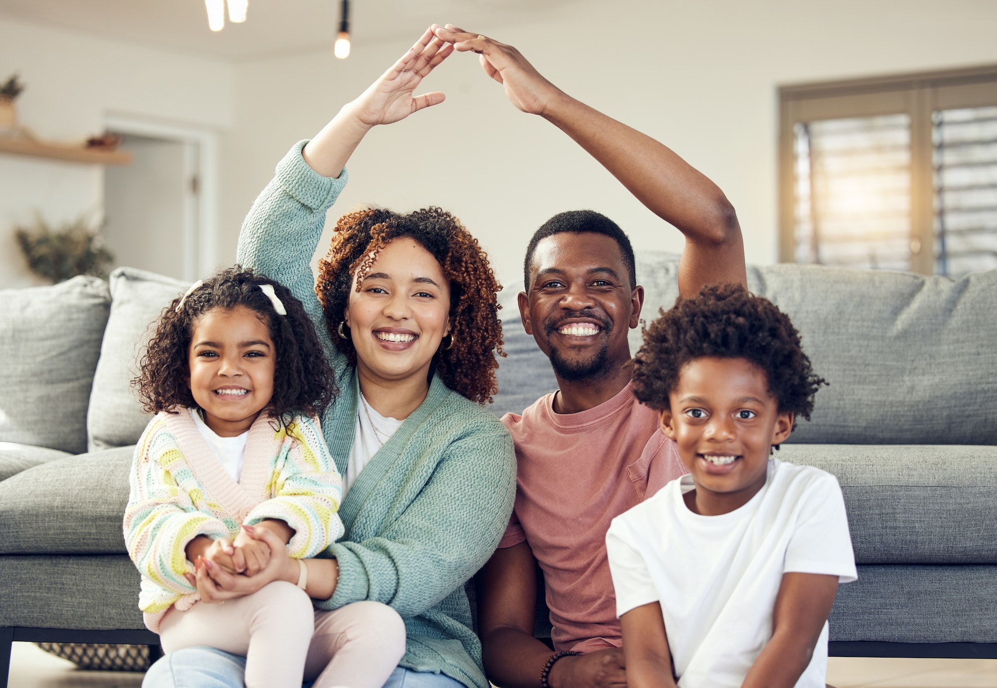 Family, portrait and security, love and insurance for protection with parents and children. Hands t